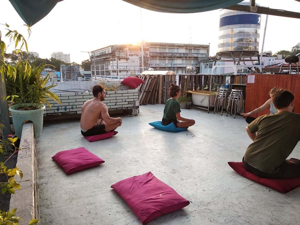 Yoga rooftop morning saigon Dablend Hostel