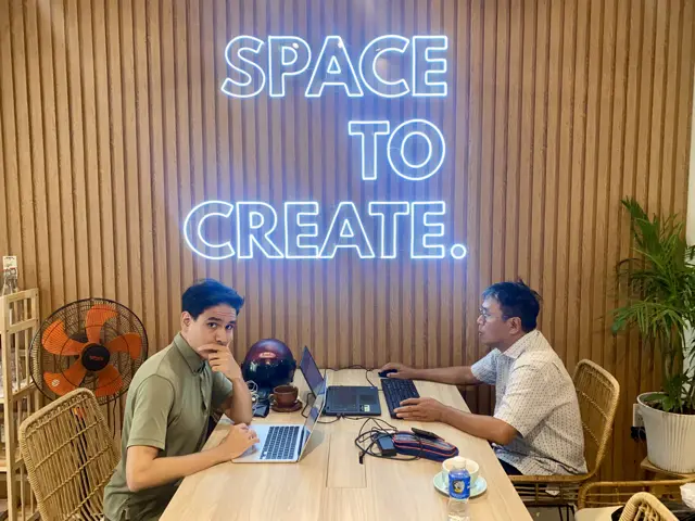 blogging from coworking office space in danang with my father who transitioned to it